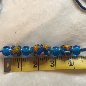 Lampwork glass focal beads flowers and plain, lot of 7 shiny beads